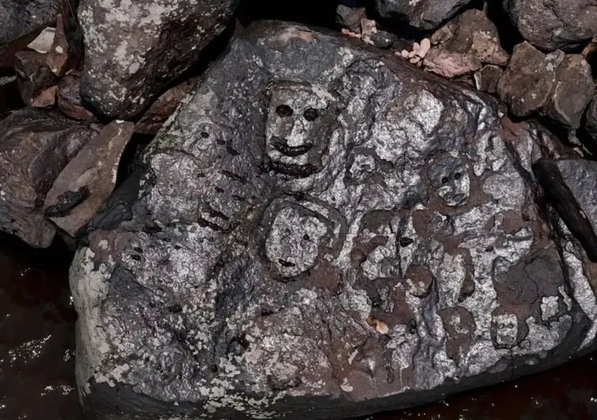 The drought in the Amazon has revealed faces carved into the rocks.