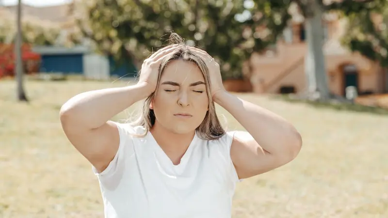 Why does your head hurt in the heat?