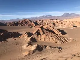person riding camel on desert during daytime