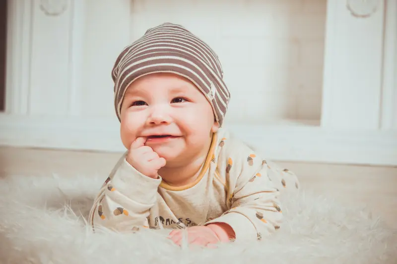 Cutie: a baby learns their native language through songs.