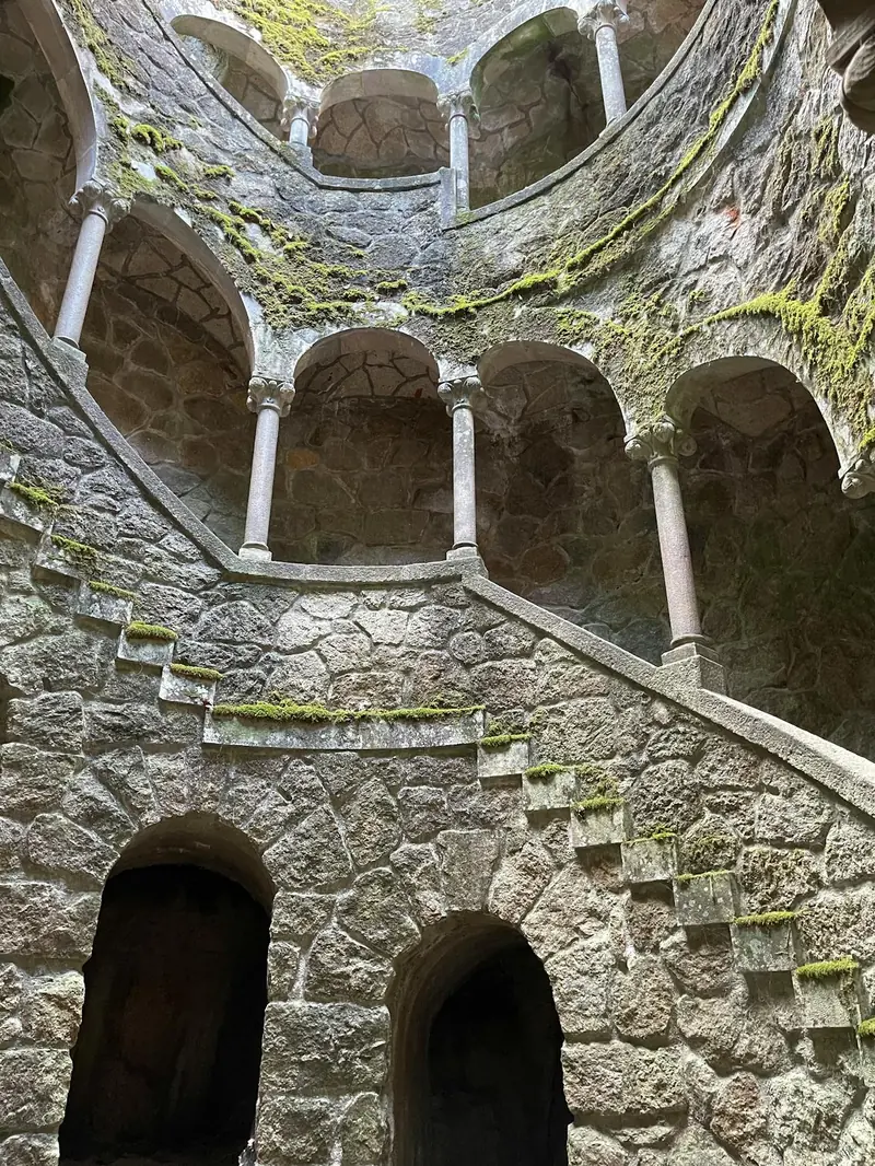Why are medieval spiral staircases designed to twist clockwise?