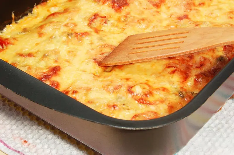 Recipe for cold days: baked pork with cheese, cream, and a vegetable medley.