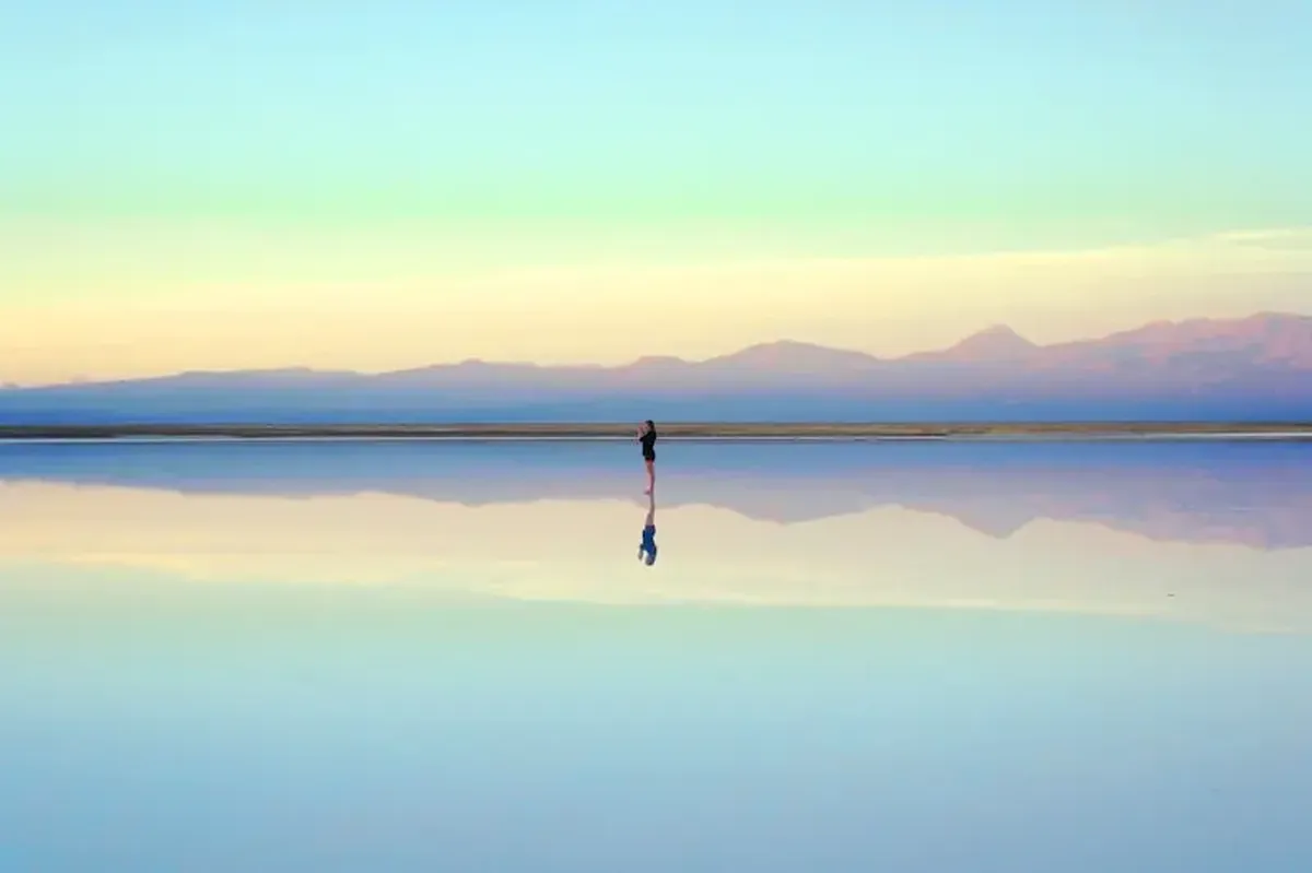 person standing near body of water during daytime