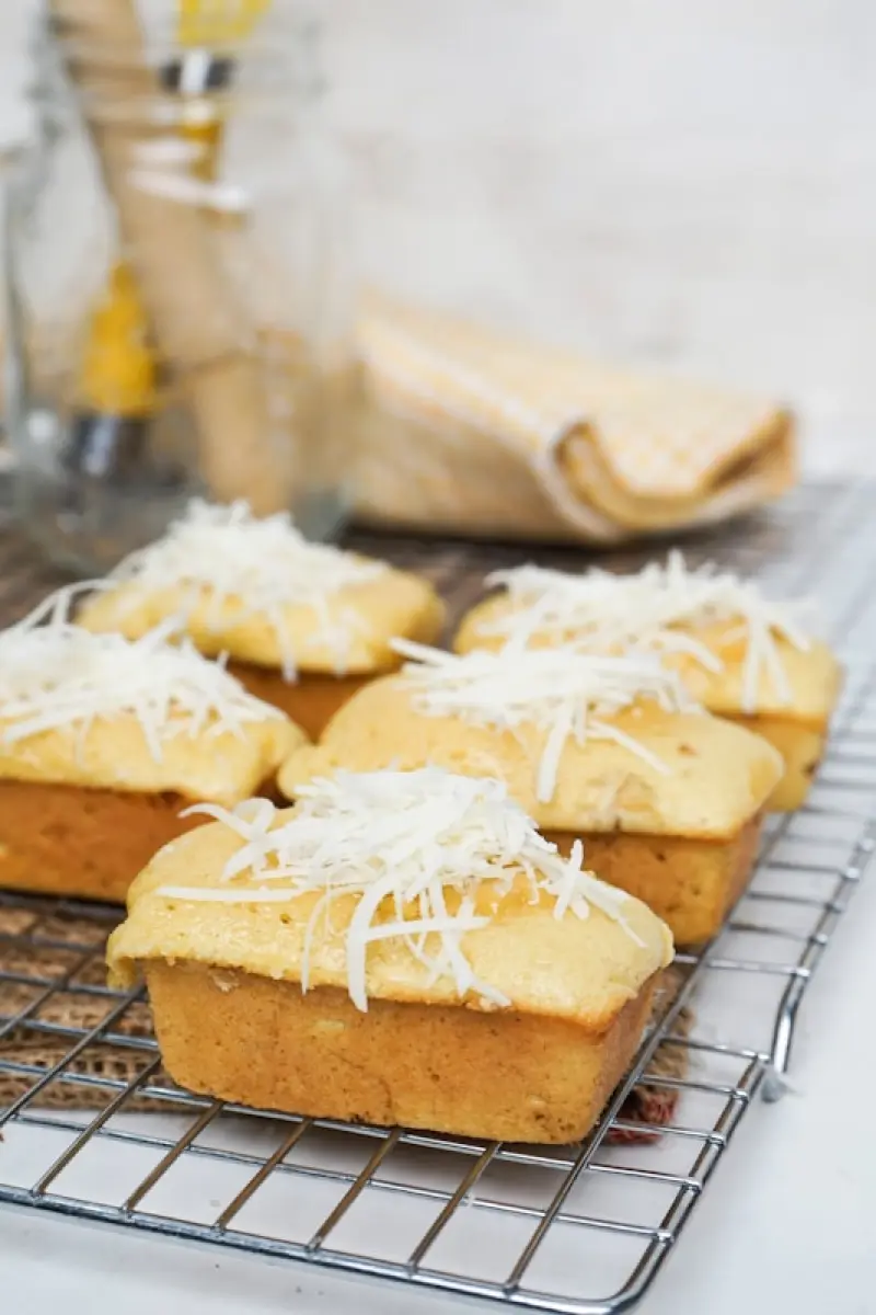 Cheesey cakes on a wire rack look delicious.