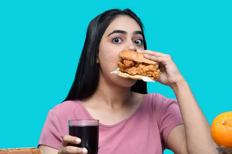 a woman eating a sandwich