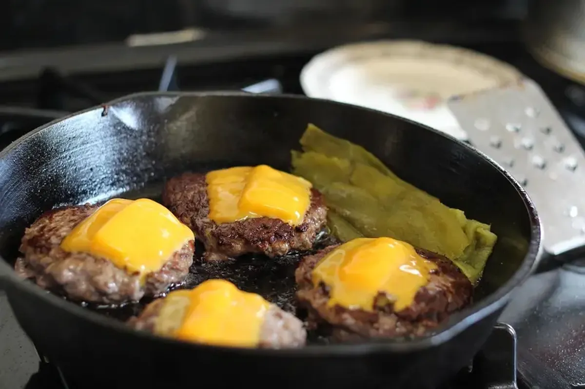 burgers on a frying pan