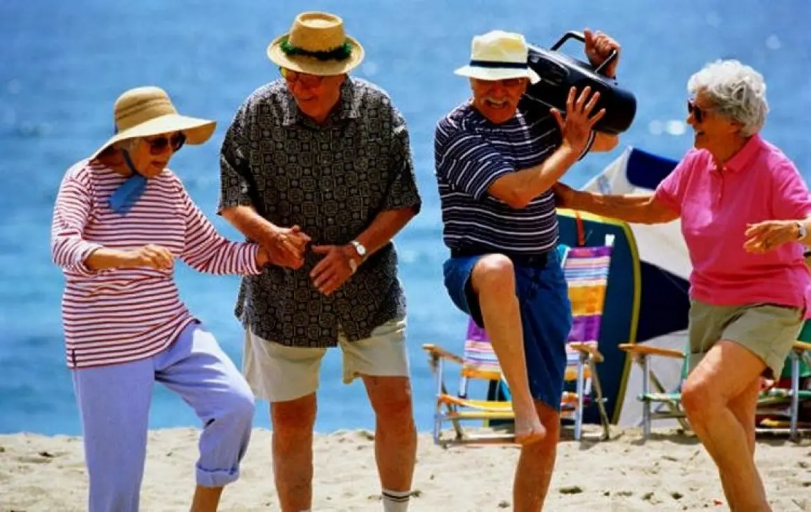 Elderly dancing on the beach