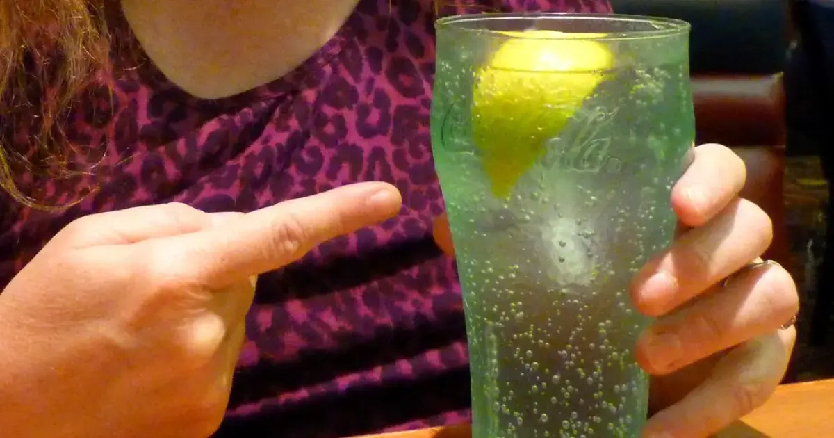 a glass of water with lemon