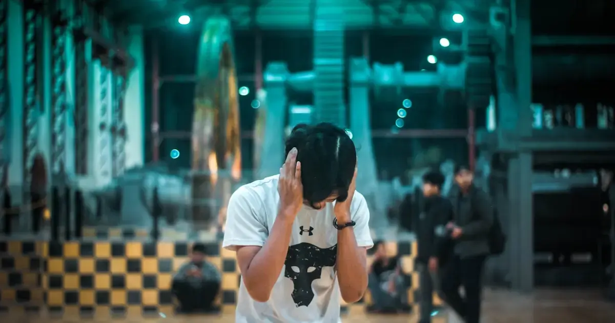 man covering his ears