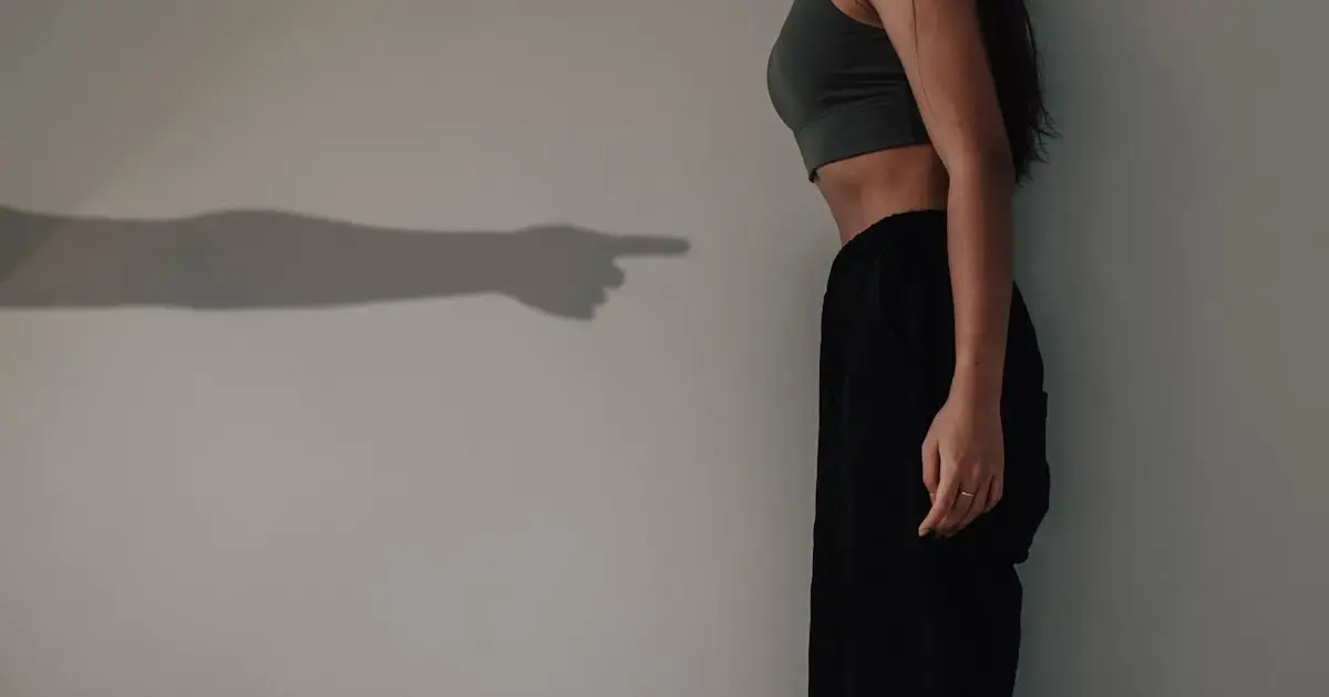 thin woman and shadow on the wall