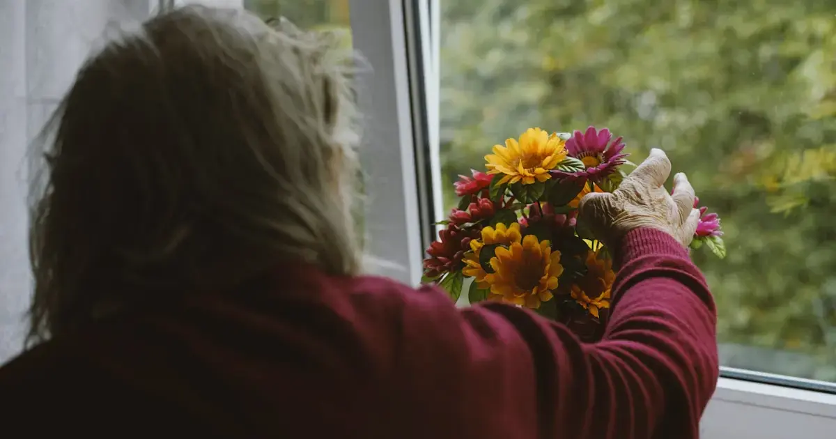 woman reaching for flowers
