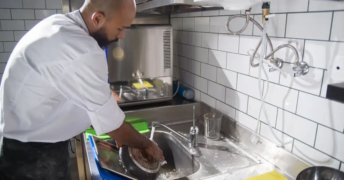 Chef washing a frying pan