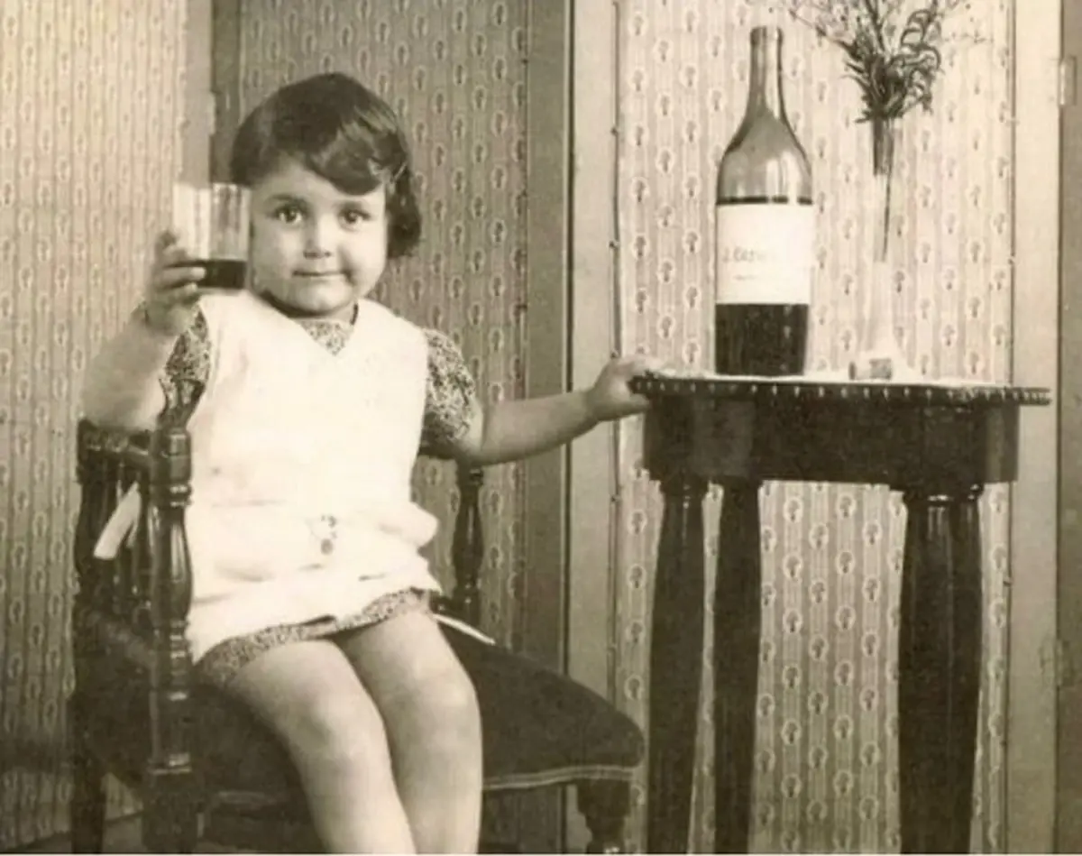 A Child with Wine. France. 1950s.