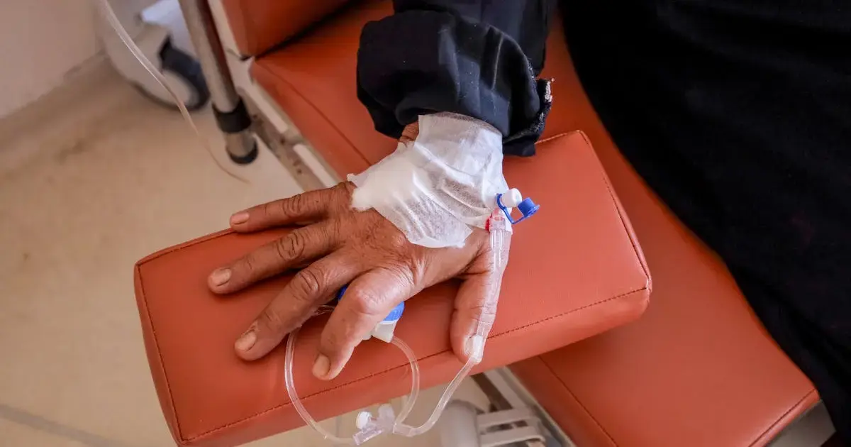 hand with an IV drip