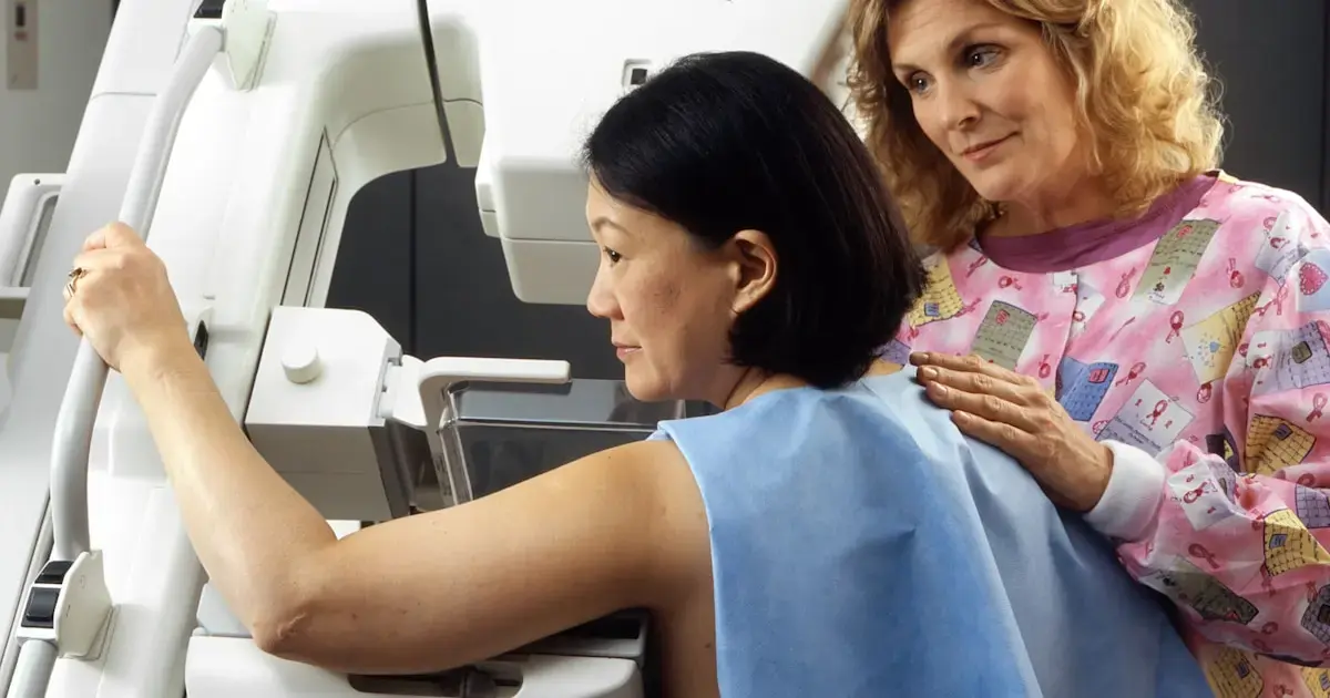 woman undergoing a mammogram
