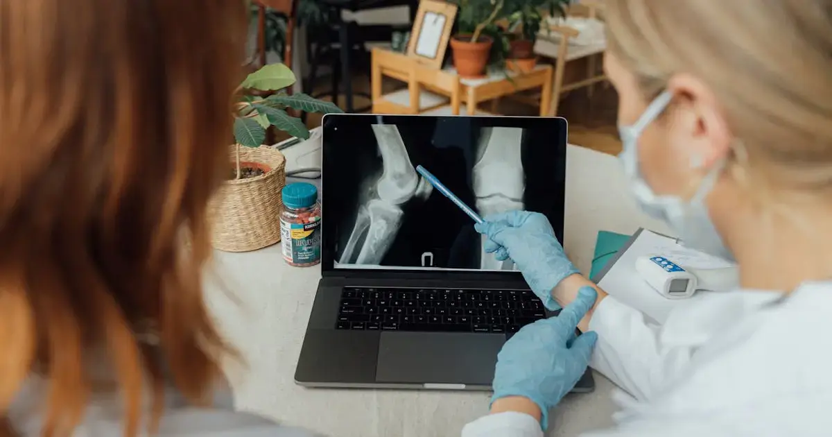 Doctor examining joint X-rays