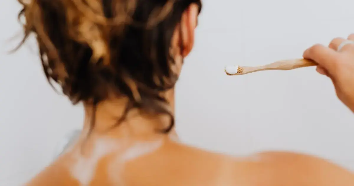 woman brushing teeth