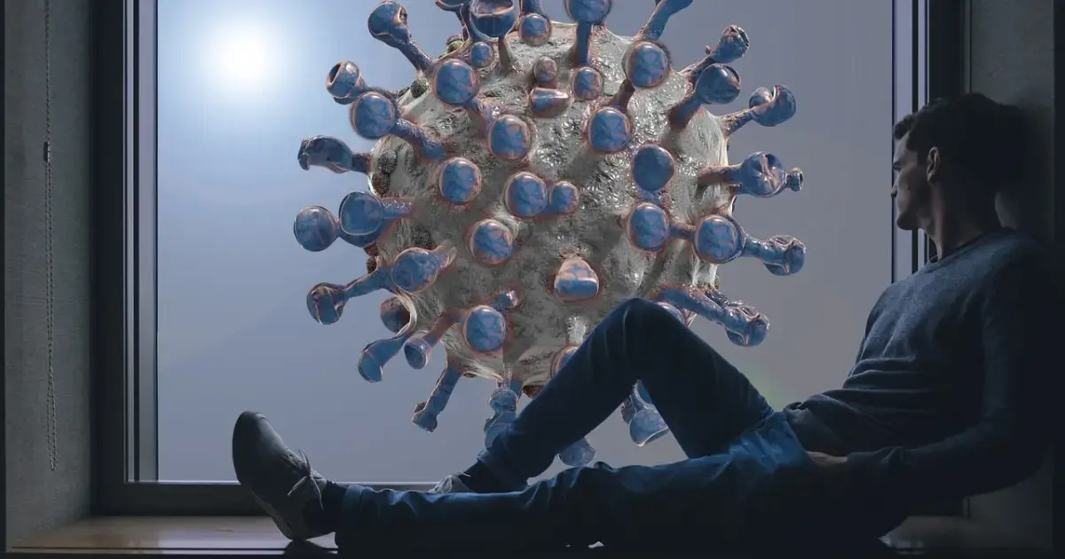 person next to an image of the coronavirus