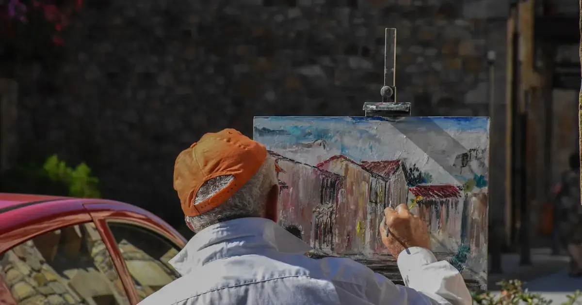 man painting a picture