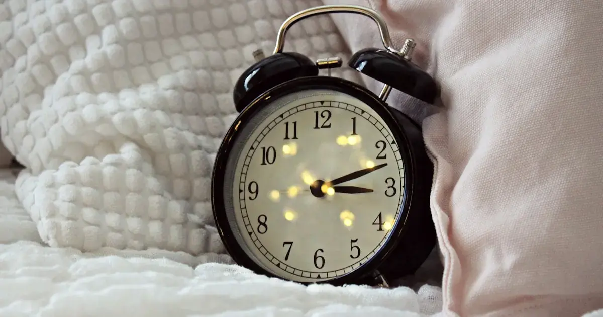 an alarm clock in bed