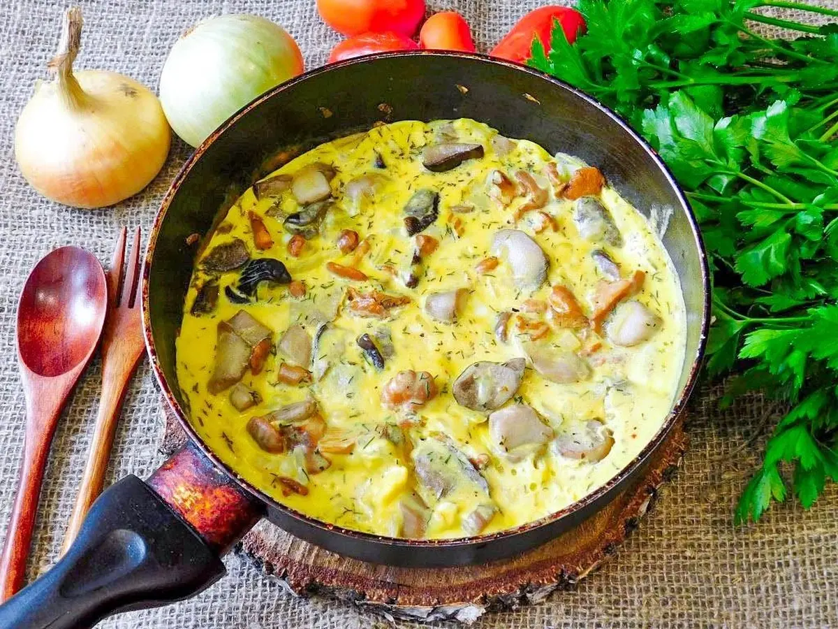 Omelet with Mushrooms in a Skillet