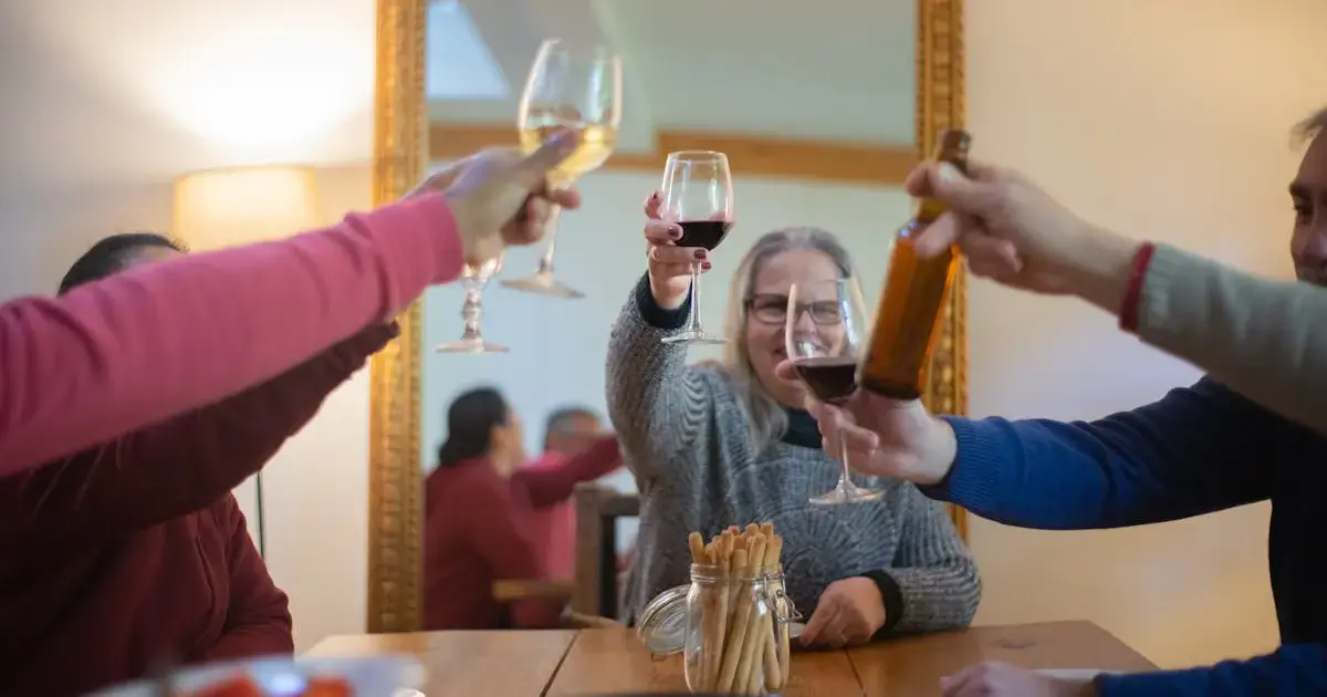 people at a table with various alcoholic beverages