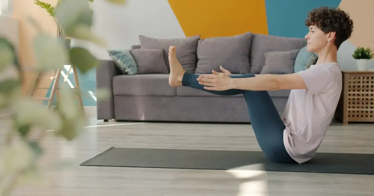 woman practicing yoga on a mat