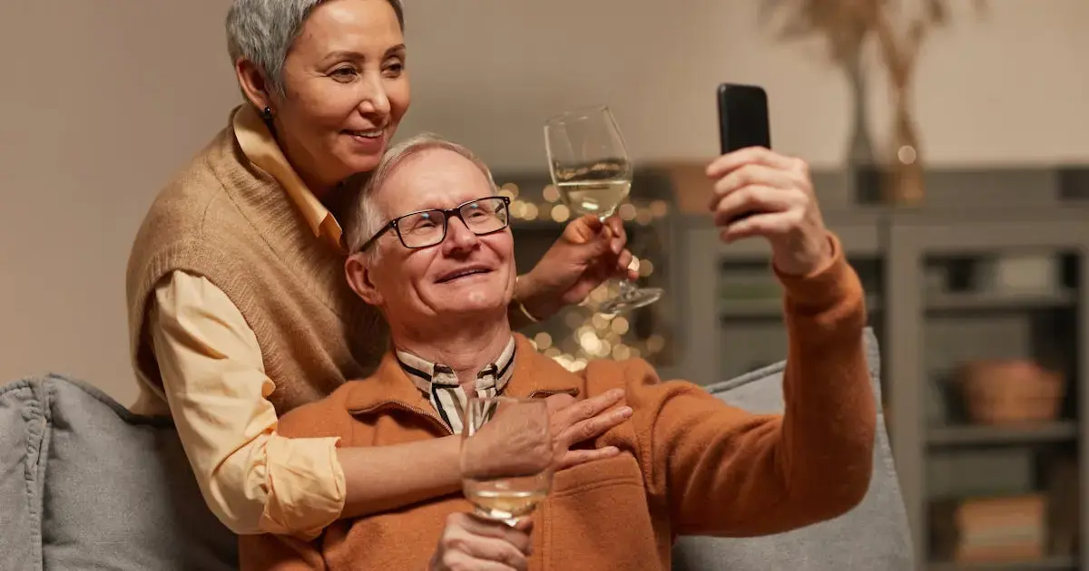 Happy elderly couple with wine