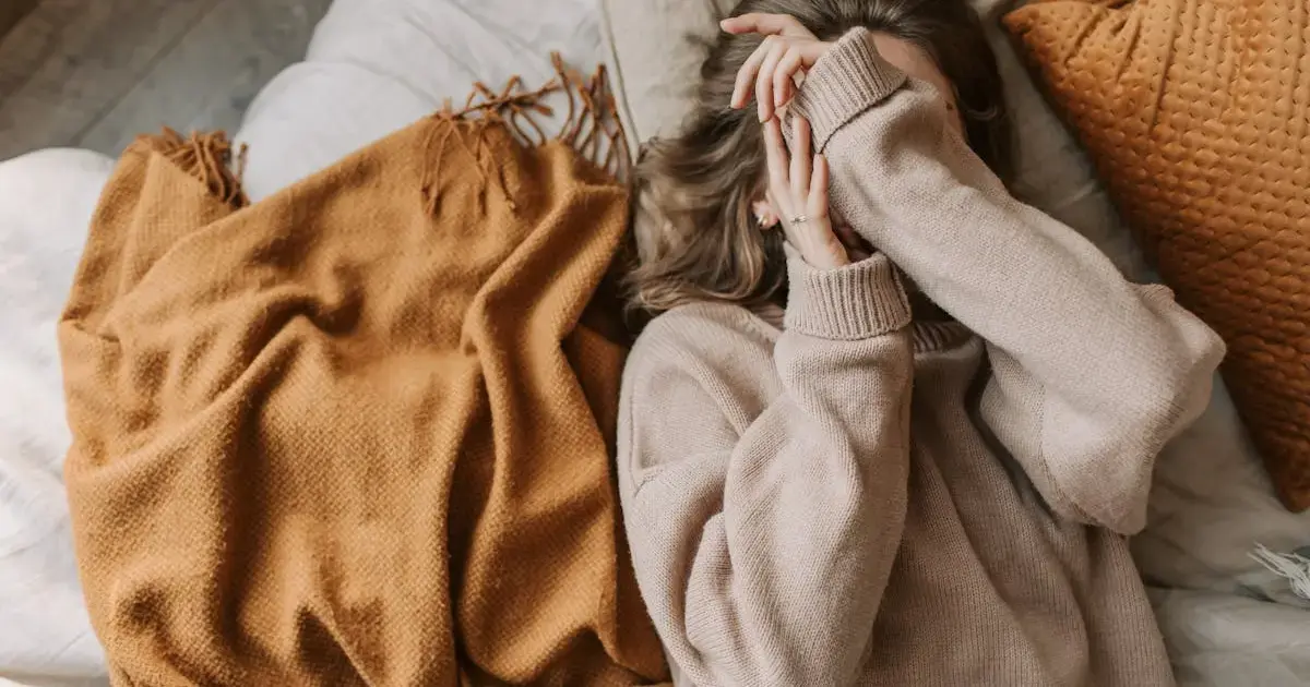 woman lying on a bed