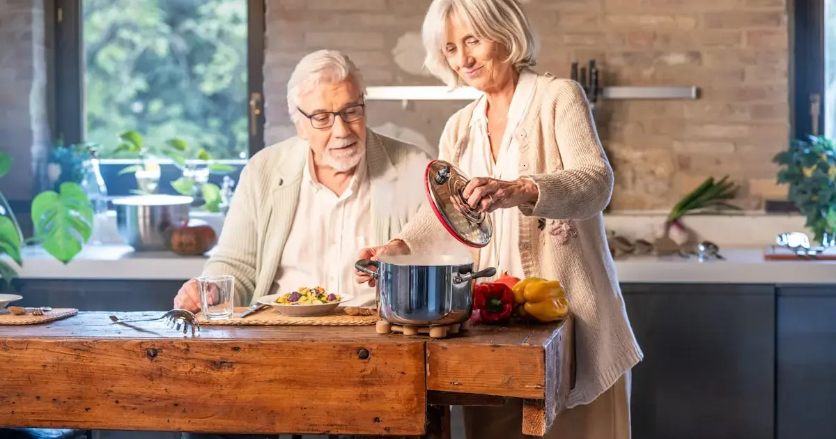man and woman cooking in the kitchen