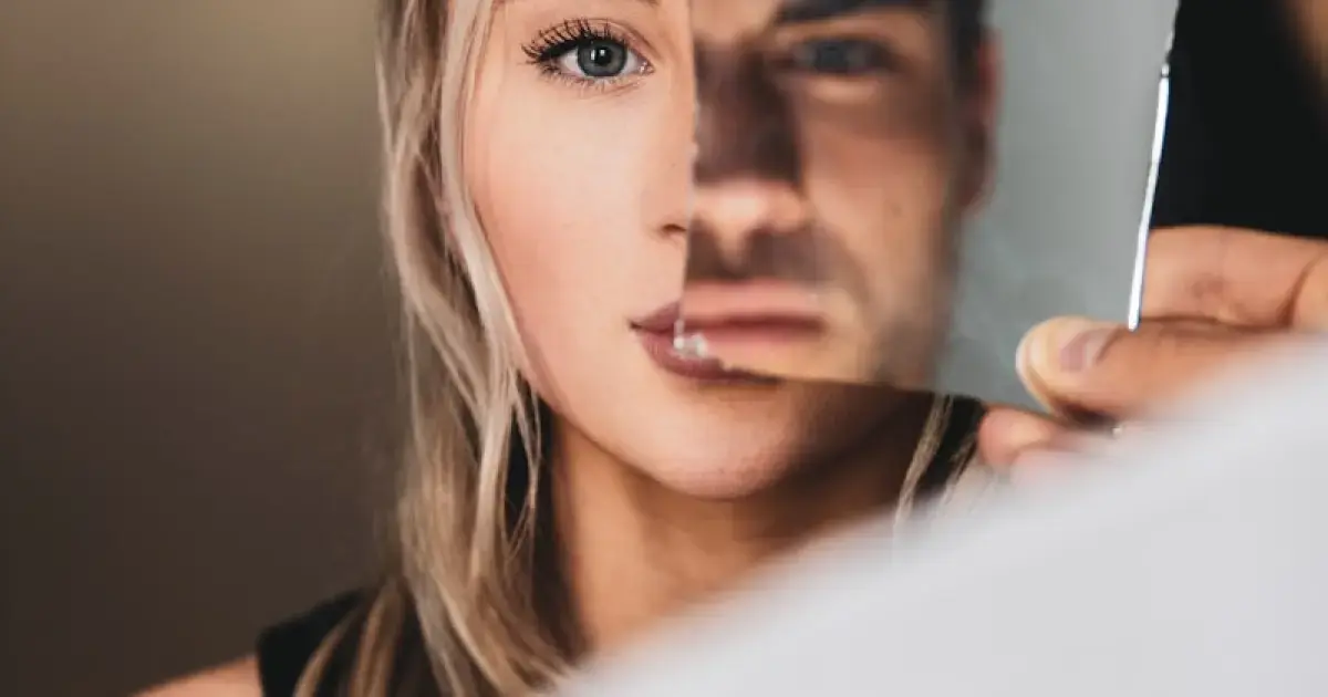 man and woman with a shard of a mirror