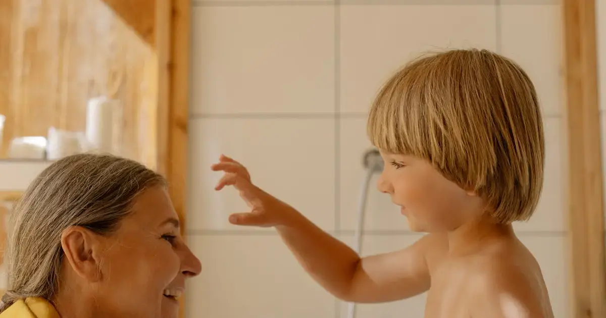 grandmother with grandson in the bath