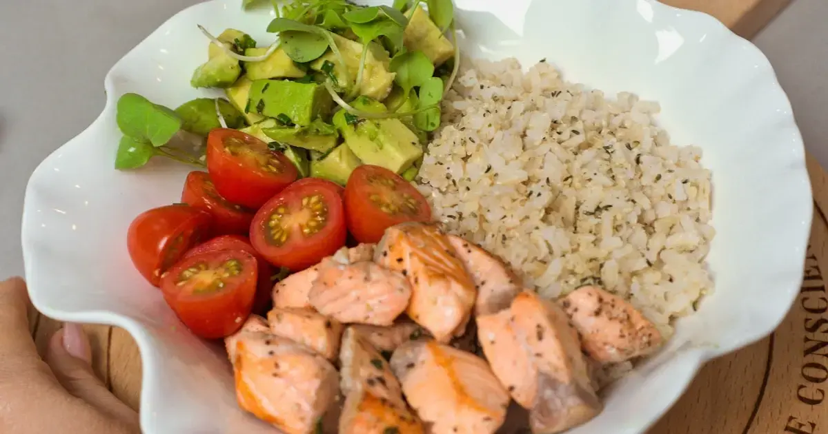 plate with rice, vegetables, chicken fillet