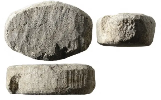 A smooth white stone dating back to the Roman era, found in the Netherlands, has long puzzled researchers. (Antiquity/AFP)