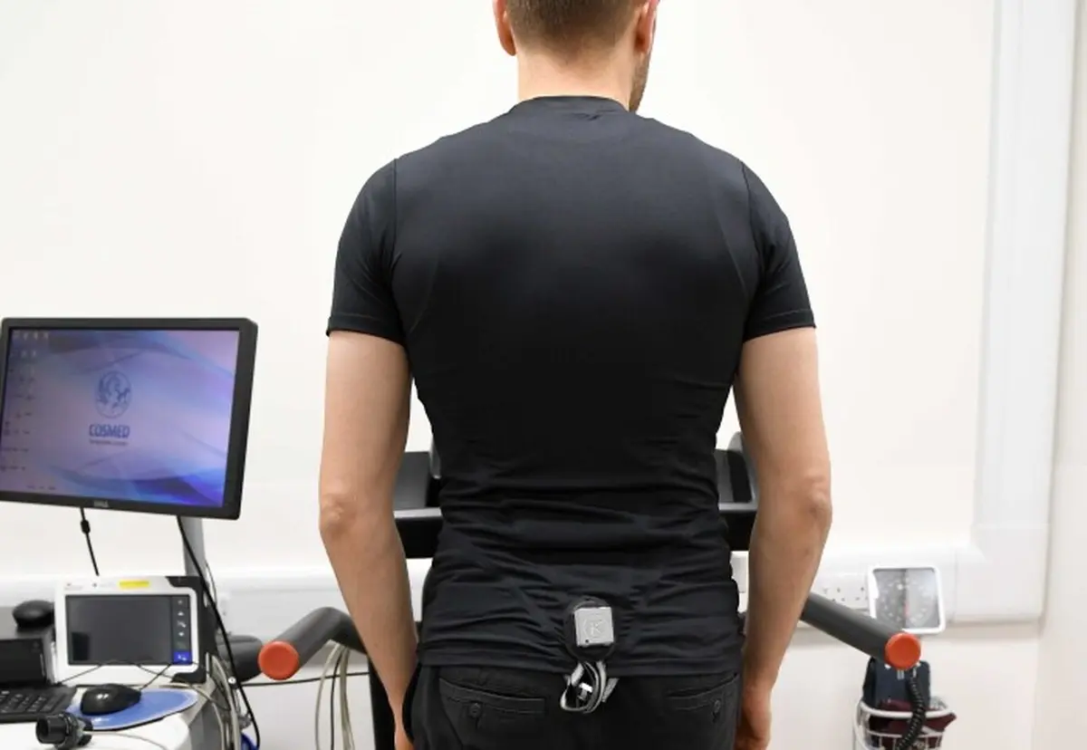 Man on a treadmill wearing a shirt that takes a cardiogram