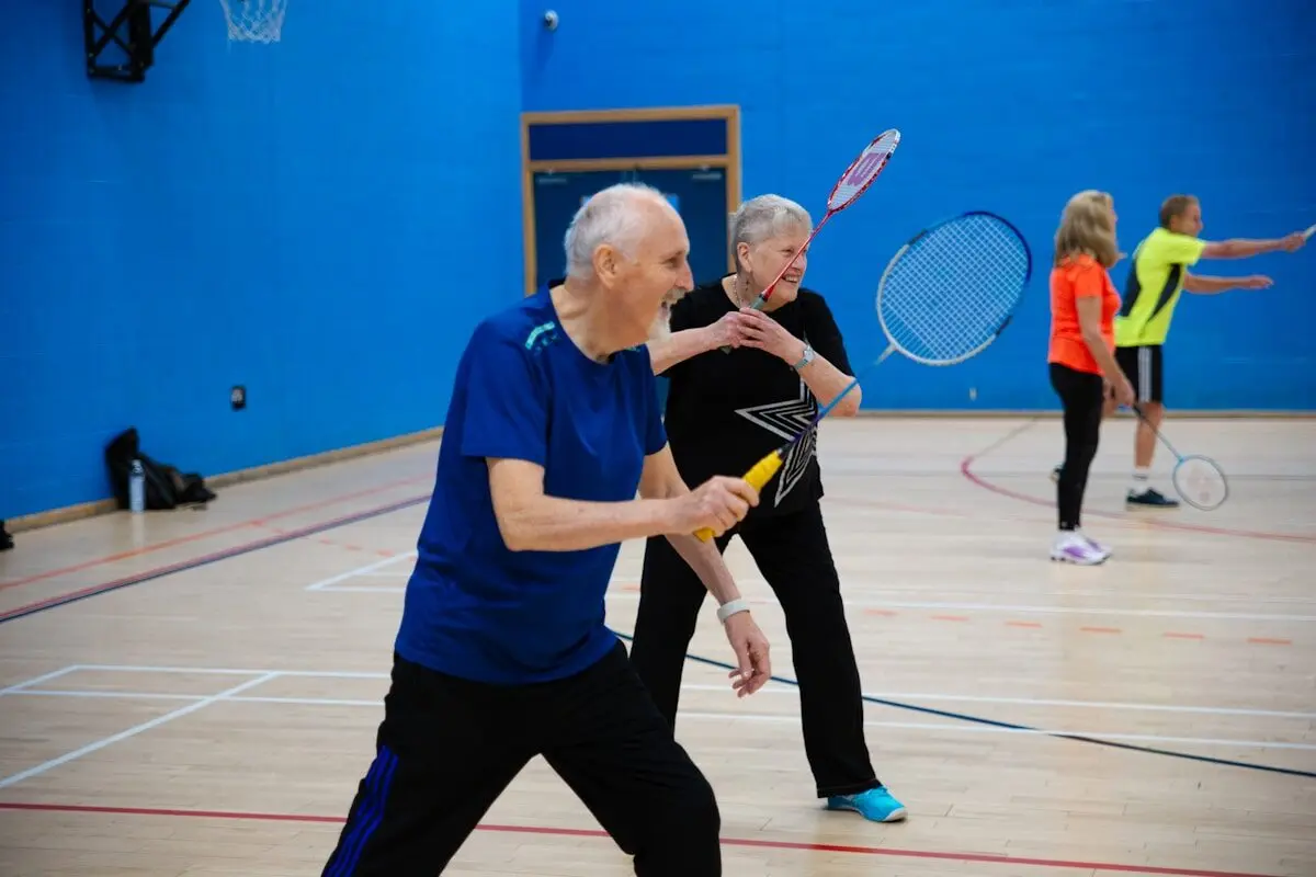 older adults playing badminton
